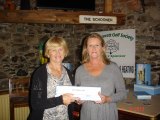 Pat collects her prize in Category 2